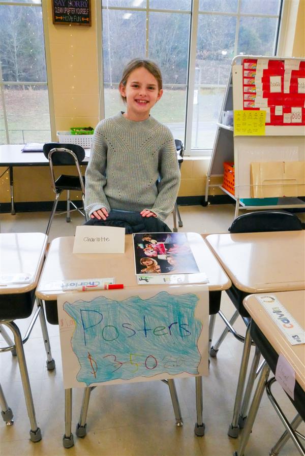 girl selling posters